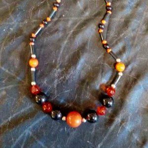 VINTAGE GRADUATING RED AND BLACK NECKLACE WITH ROUND, TUBED, & RED CRYSTAL BEADS